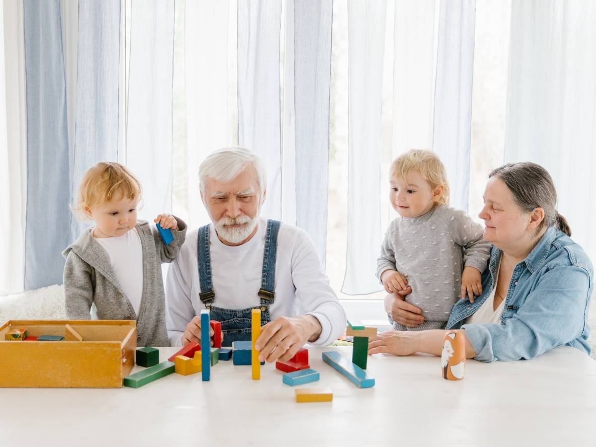 toddlers visiting grandparent in nursing home