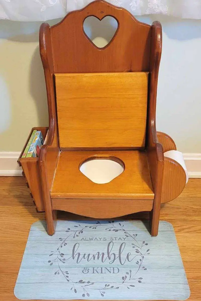 wooden potty-training seat with dollar store placemat to protect the floor from potty training accidents