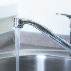 water pouring from faucet